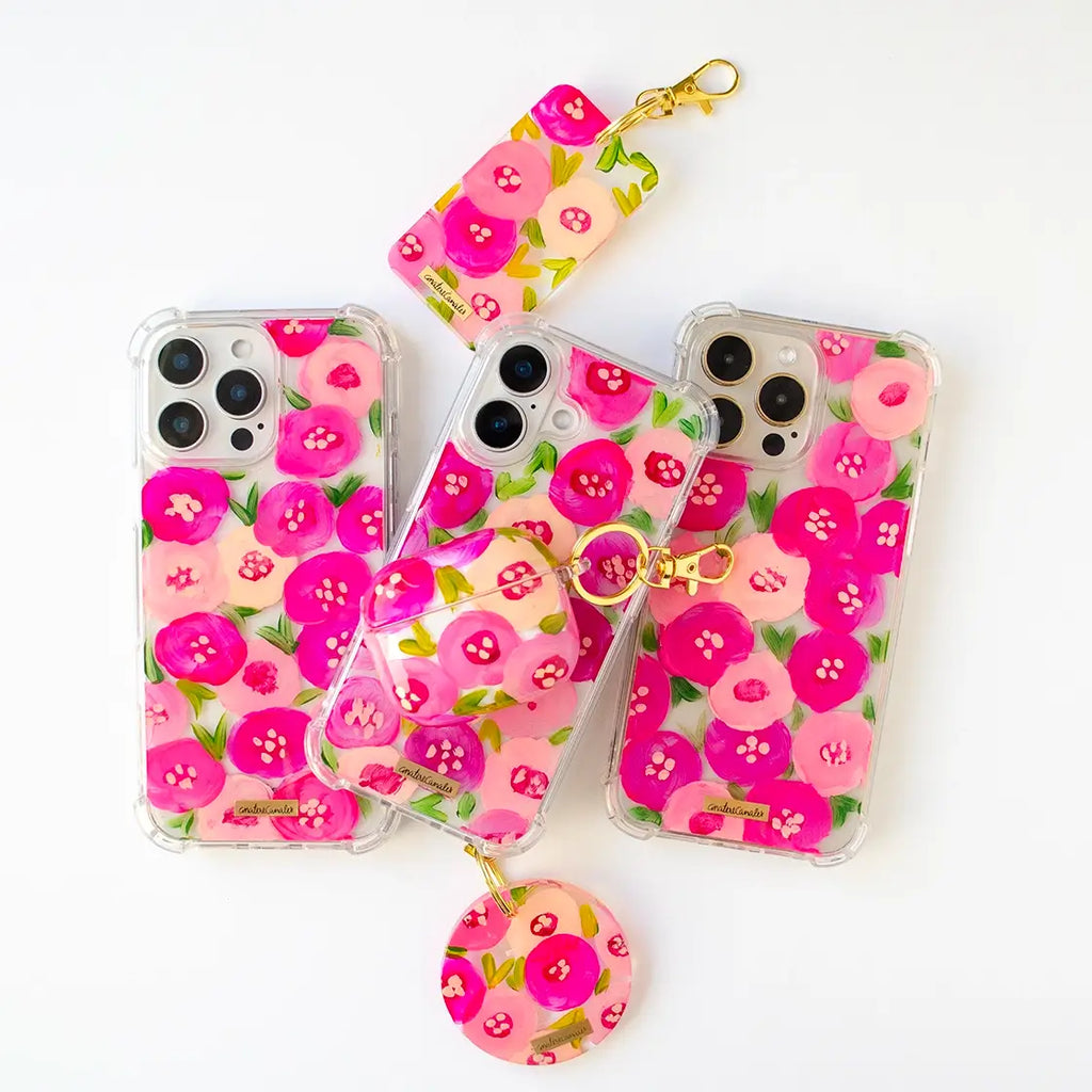 Llaveros y fundas para proteger iPhone y AirPods, pintadas a mano por Ana Tere Canales. Un diseño de flores rosadas elegante en tonos rosa suaves.