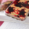 Funda para iPhone Burgundy Rose Gold pintada a mano por Ana Tere Canales. Un diseño artístico en tonos burgundy y rose gold.