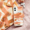 Fundas para iPhone y MacBook Cinnamon Swing pintadas a mano por Ana Tere Canales. Un diseño artístico de pinceladas abstractas en tonos cinnamon.