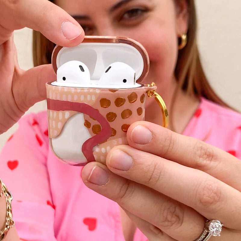 Funda para AirPods Conexión pintados a mano por Ana Tere Canales. Un diseño artístico abstracto que simboliza la unión y las conexiones humanas.