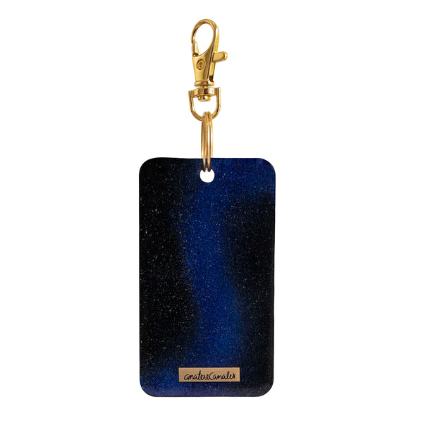 Llavero Cosmic Reaction pintada a mano por Ana Tere Canales. Un diseño artístico inspirado en galaxias, nebulosas y el universo en tonos vibrantes.