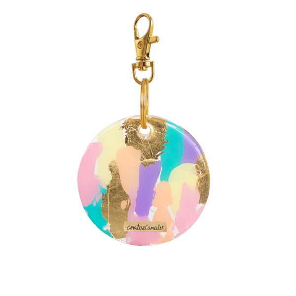 Llavero Golden Hour pintado a mano por Ana Tere Canales. Un diseño artístico en tonos dorados inspirado en la luz del atardecer.