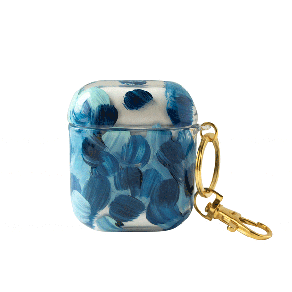 Funda para proteger AirPods, pintada a mano por Ana Tere Canales. Un diseño en tonos azules, representando las olas del mar.