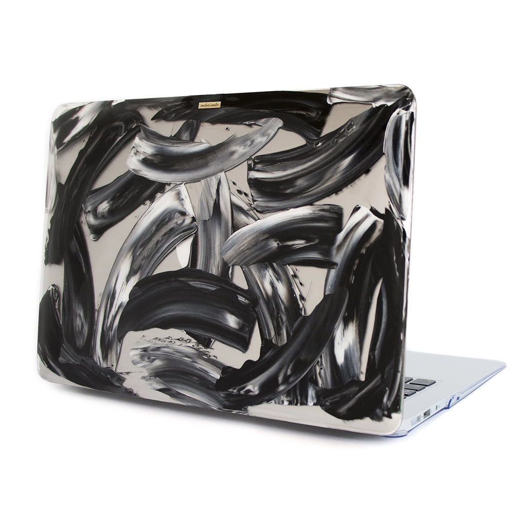 Funda para proteger MacBook, pintada a mano por Ana Tere Canales. Un diseño monocromático moderno.