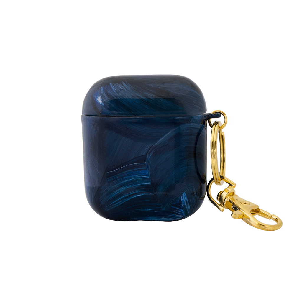 Funda para AirPods Pacífico pintada a mano por Ana Tere Canales. Un diseño artístico inspirado en el océano en tonos azules.